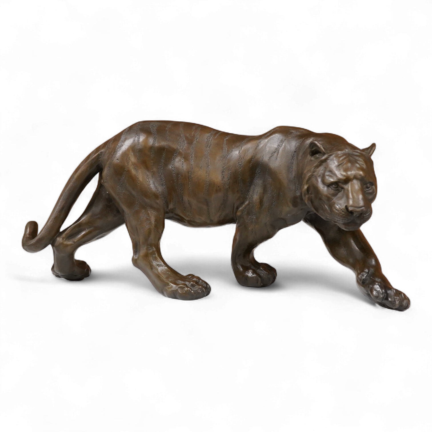 After Salvatore Melani (1902-1934), contemporary patinated bronze of a tiger, 39cm wide